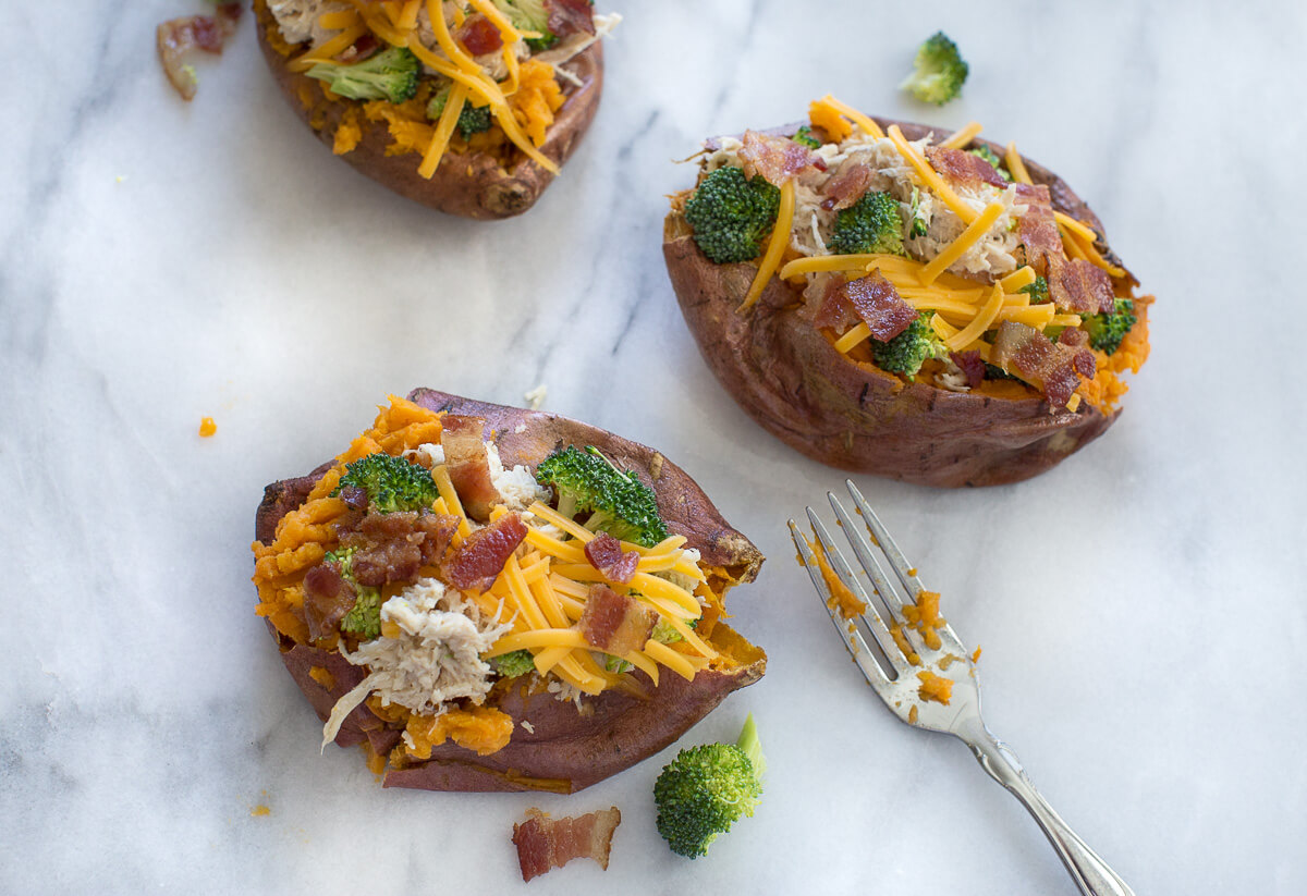 overhead shot of crack chicken and broccoli stuffed in sweet potato 