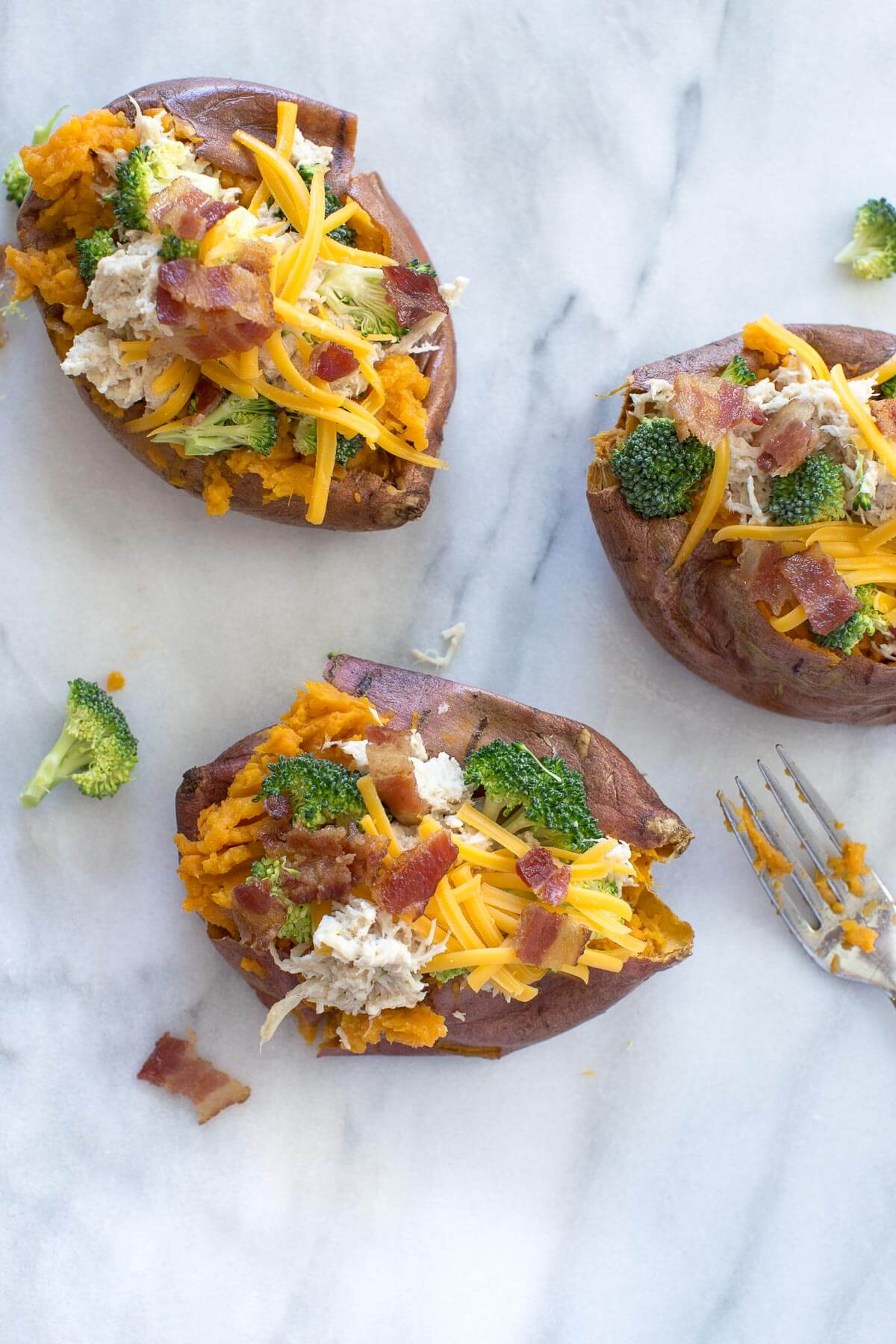 overhead shot of sweet potato stuffed with crack chicken and broccoli