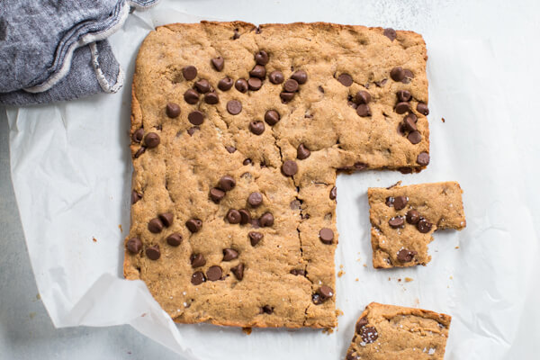 Overhead shot of almond butter blondies sprinkled with chocolate chips