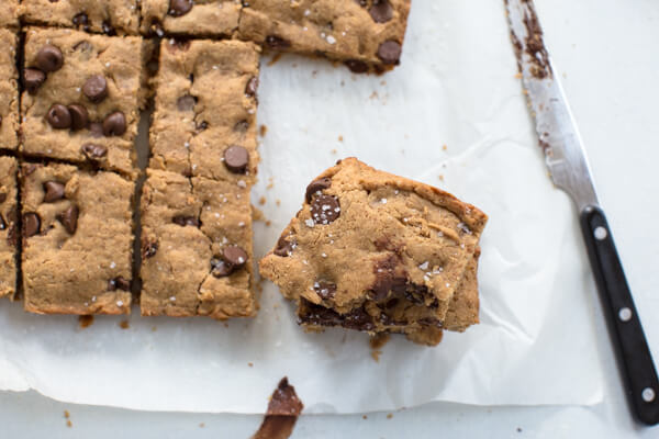 overhead shot of chewy almond butter blondie sprinkled with sea salt 