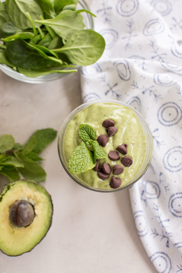 overhead shot of mint chocolate chip avocado smoothie