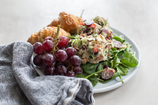 Greek Yogurt Chicken Salad with grapes is life changing. Make this easy chicken salad recipe made with grapes, cranberries, and almonds for healthy lunch meal prep.