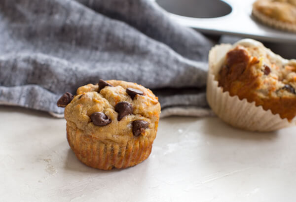 side shot of gluten free carrot cake muffin with chocolate chips 