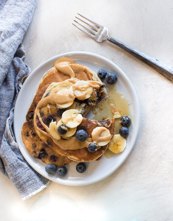 gluten free pancakes drizzled with maple syrup 