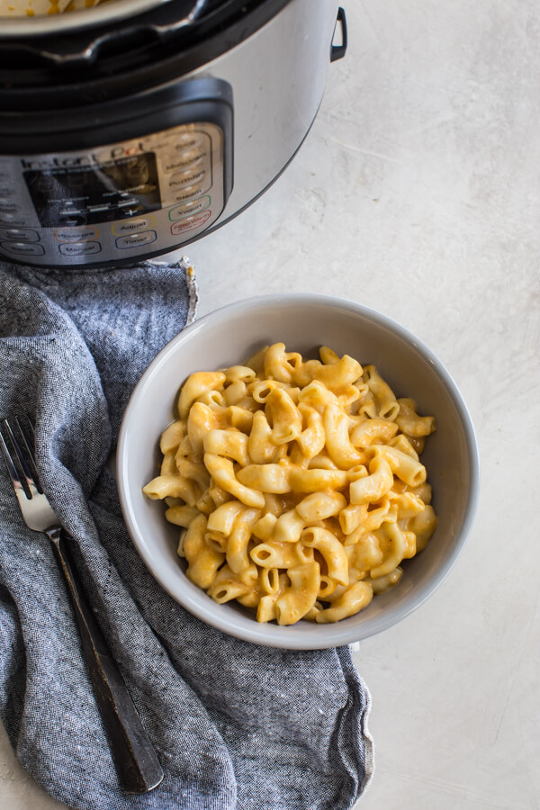 This is the best Instant Pot Mac and Cheese recipe with hidden veggies-- it's a fan favorite kid friendly meal around here. Easy homemade mac n cheese recipe ready in 5 minutes! Woot woot!