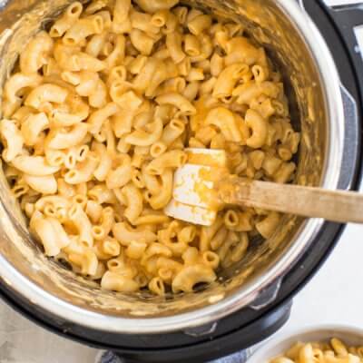 This is the best Instant Pot Mac and Cheese recipe with hidden veggies-- it's a fan favorite kid friendly meal around here. Easy homemade mac n cheese recipe ready in 5 minutes! Woot woot!