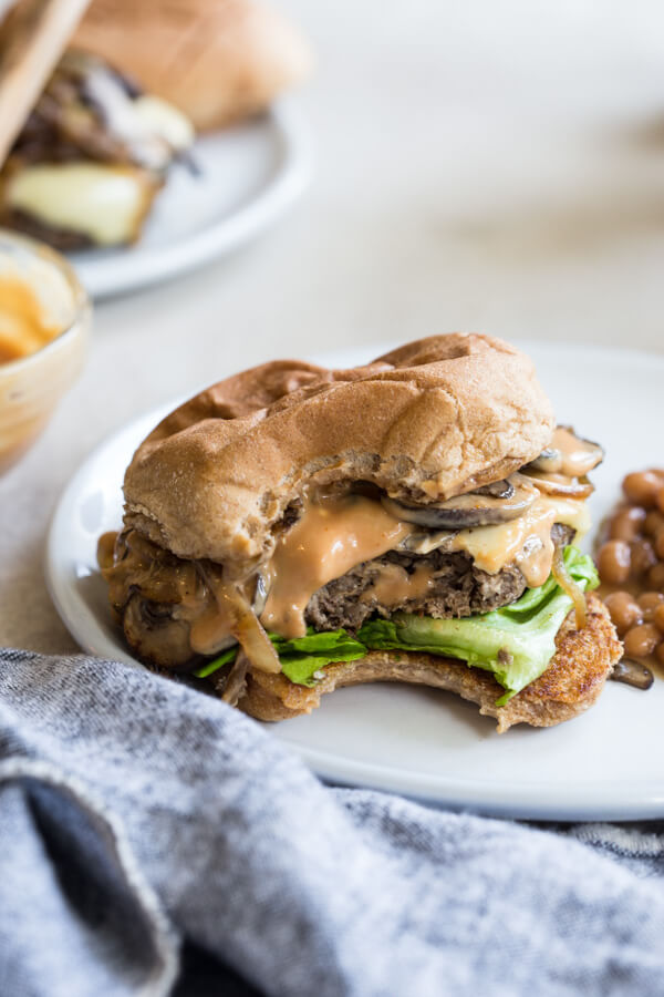 Mushroom Swiss Burger = the best gourmet burger recipe you’ve ever tasted. Complete with the best burger seasoning recipe and simple burger sauce for a juicy homemade mushroom beef burger! 