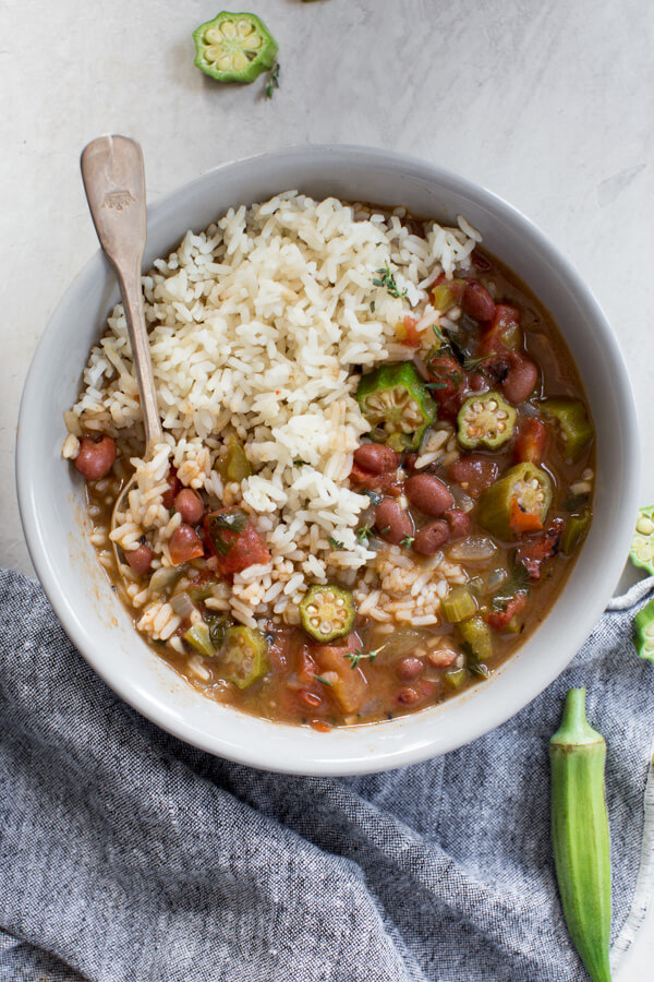 Easy Vegetable Gumbo recipe made with an authentic dark French roux, okra, tomatoes and Creole seasonings. Loaded with Louisiana flavors and beans!