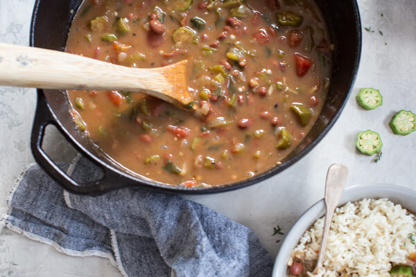 Easy Vegetable Gumbo recipe made with an authentic dark French roux, okra, tomatoes and Creole seasonings. Loaded with Louisiana flavors and beans! 