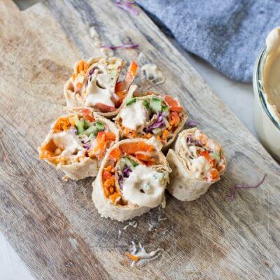 Easy pinwheel recipe for kids = Rainbow Veggie Pinwheels. A veggie loaded kid friendly lunch box recipe made with white bean hummus that encourages them to eat the rainbow. #pinwheels #veggie #rainbow #kidfriendly #lunchboxideas #healthykidrecipes