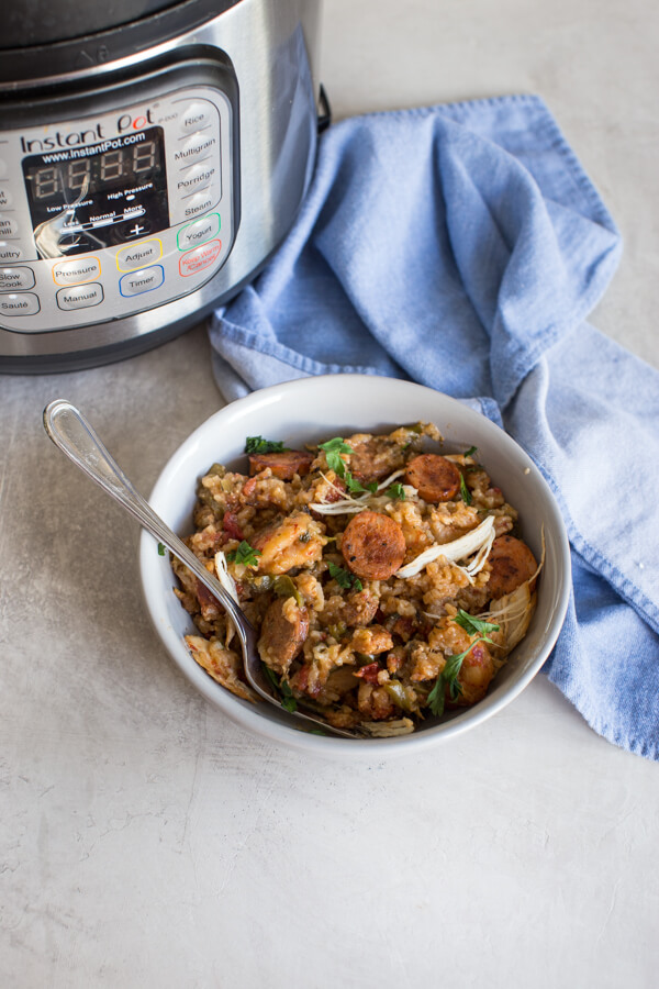 Instant Pot Jambalaya, a healthy jambalaya recipe made with brown rice, andouille chicken sausage, jumbo shrimp, chicken cutlets, lots of veggies and creole seasoning. Easy instant pot recipes are life.