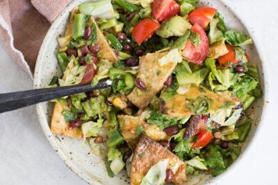 How to make Fiesta Fattoush Salad with fried flour tortillas, black beans, and homemade cilantro lime dressing. Easy weeknight dinner packed with veggies.