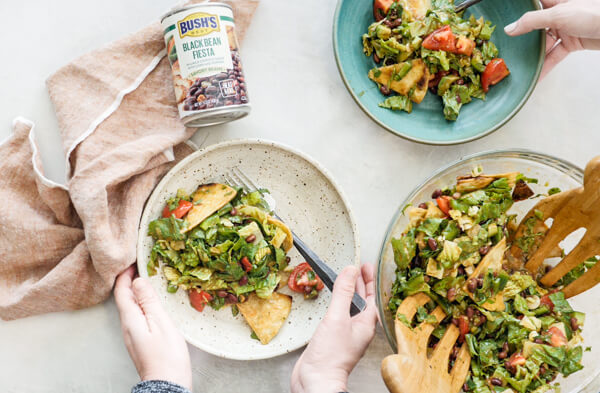 How to make Fiesta Fattoush Salad with fried flour tortillas, black beans, and homemade cilantro lime dressing. Easy weeknight dinner packed with veggies.