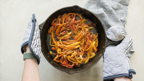 cooked fajita veggies in cast iron