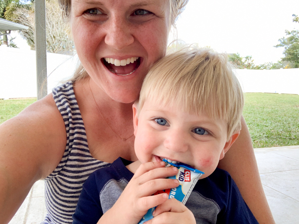 kid smiling eating Clif Bar